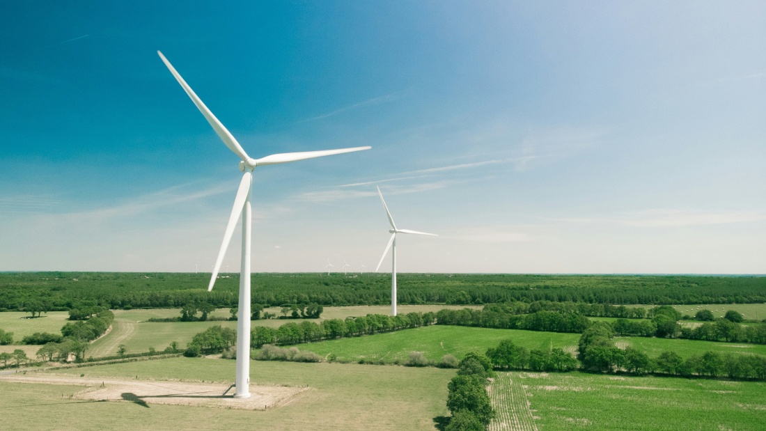 Windmill turbine machine in the middle of a field